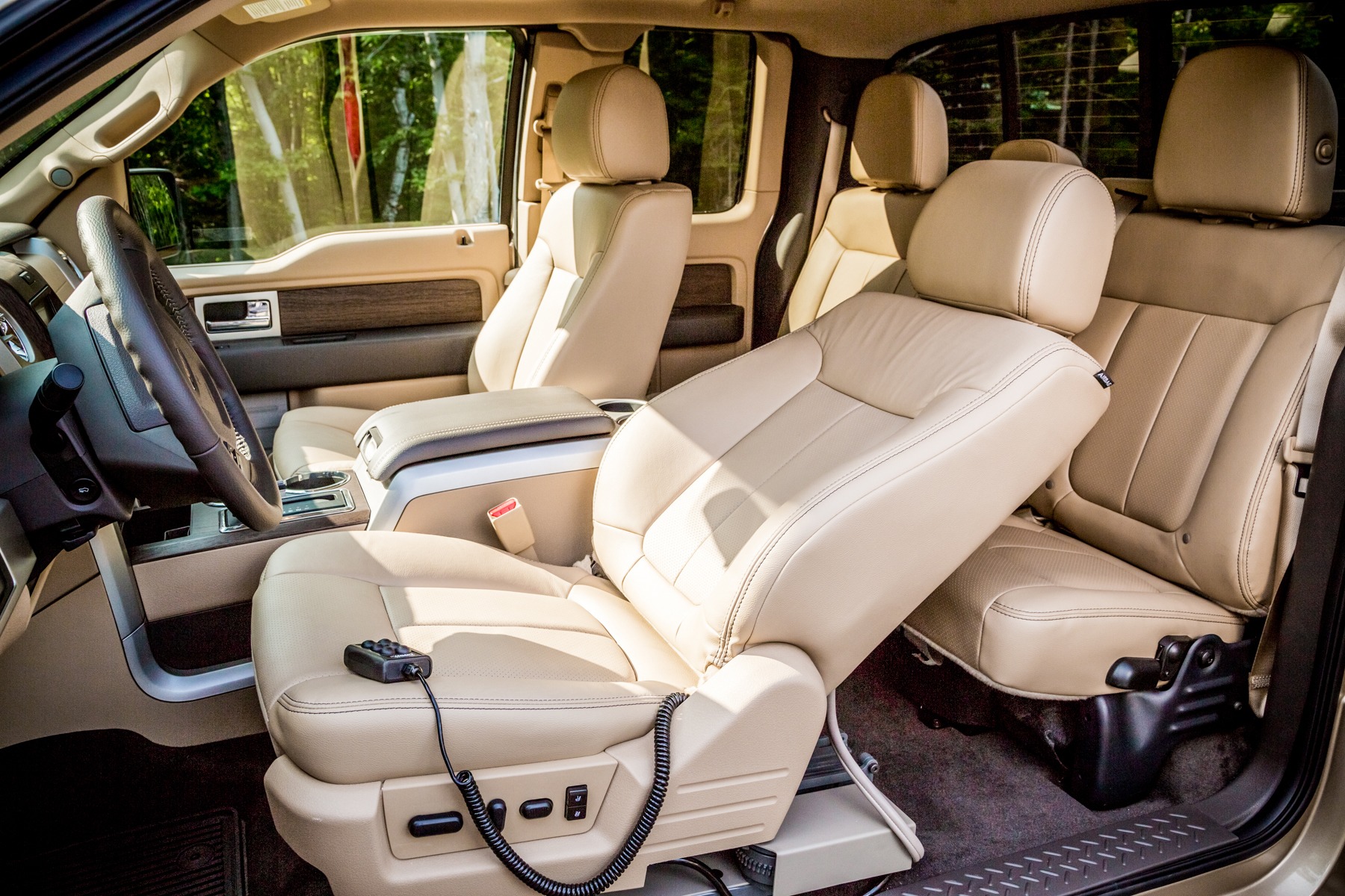 The driver's seat of the a Ford pickup reclined with the LINK turning seat installed.