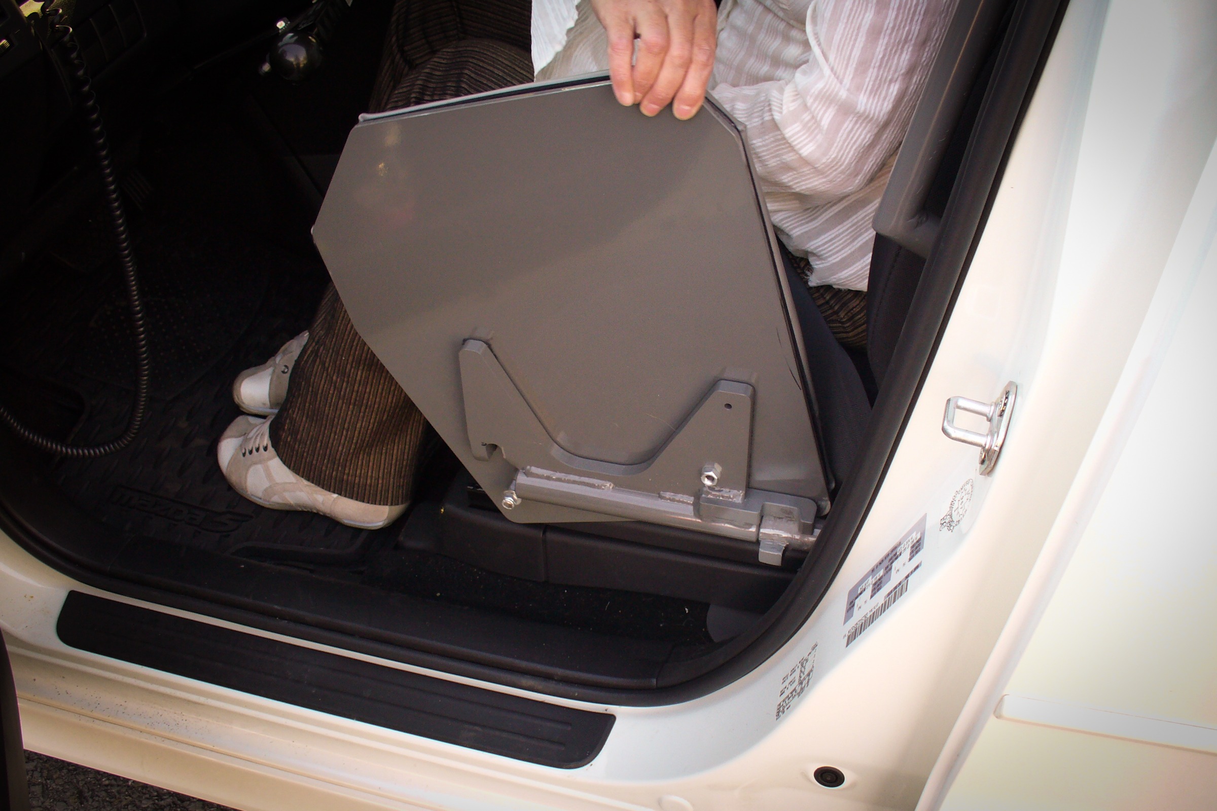 An XL-BOARD flipped up and ready for the door of the Mazda5 to close